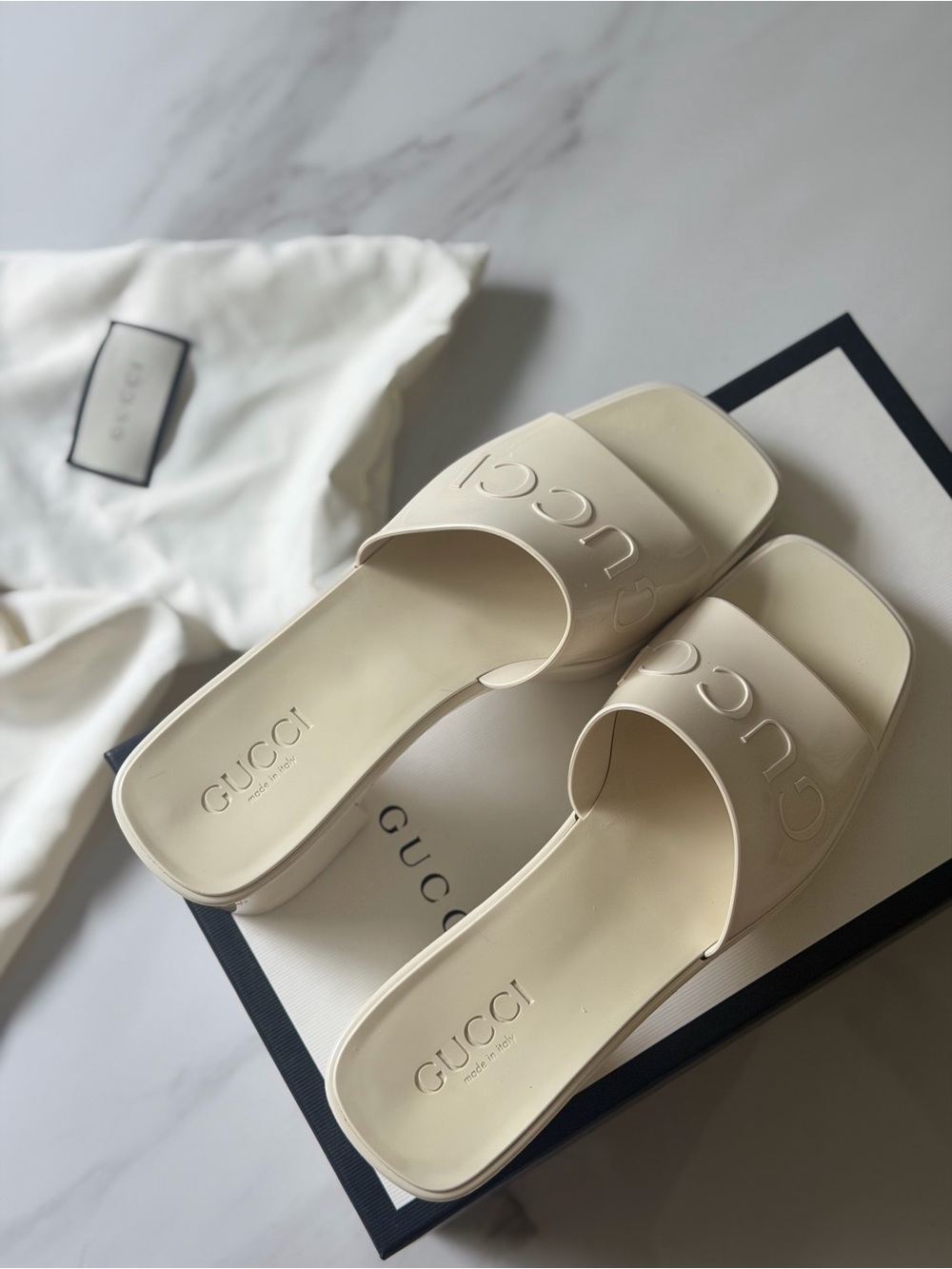 Gucci Women’s Ivory Slide Sandals with Embossed Logo